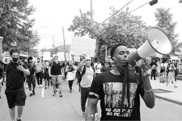 Michael Animodi (right) a protester with Young Leaders of Staten Island takes part in a march on June 9th.